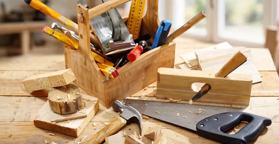 Carpentry services in Dubai: carpenter assembling a wooden cabinet in a villa